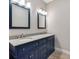 Bathroom with a blue double vanity and granite countertop at 1126 W 35Th St, Indianapolis, IN 46208