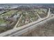 Aerial view of neighborhood including a pond and houses near highway at 6233 Lafayette Rd, Indianapolis, IN 46278