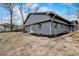 Gray-sided ranch house with a newly landscaped yard and large backyard at 6233 Lafayette Rd, Indianapolis, IN 46278