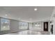 Spacious living room with hardwood floors and large windows at 6233 Lafayette Rd, Indianapolis, IN 46278