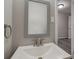 Modern bathroom with grey vanity and white sink at 6233 Lafayette Rd, Indianapolis, IN 46278