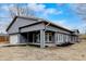 Newly renovated ranch house exterior, gray siding, updated landscaping, and attached garage at 6233 Lafayette Rd, Indianapolis, IN 46278