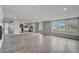 Open living room with hardwood floors and view into kitchen at 6233 Lafayette Rd, Indianapolis, IN 46278