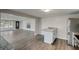 Open concept kitchen with granite island and stainless steel appliances at 6233 Lafayette Rd, Indianapolis, IN 46278