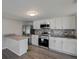 Modern kitchen with stainless steel appliances and granite countertops at 6233 Lafayette Rd, Indianapolis, IN 46278