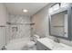 Modern bathroom with grey vanity and marble tile shower at 6233 Lafayette Rd, Indianapolis, IN 46278