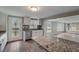 Modern kitchen with granite countertops, stainless steel appliances and view to living room at 6233 Lafayette Rd, Indianapolis, IN 46278
