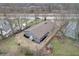 Aerial view showing a renovated ranch house, landscaping, and surrounding area at 6233 Lafayette Rd, Indianapolis, IN 46278