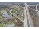Aerial view of neighborhood including a pond and houses near highway at 6233 Lafayette Rd, Indianapolis, IN 46278
