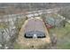 Aerial view of a renovated ranch house with new roof and landscaping at 6233 Lafayette Rd, Indianapolis, IN 46278