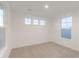 Bright bedroom with neutral carpeting and large windows offering ample natural light at 9310 Anthem Ave, Plainfield, IN 46168