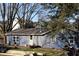 Blue house exterior with mature trees and landscaping at 306 S Cherry St, Westfield, IN 46074