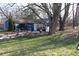 Blue house exterior with mature trees and garden at 306 S Cherry St, Westfield, IN 46074