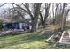 Blue house exterior with mature trees and garden at 306 S Cherry St, Westfield, IN 46074