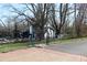 Blue house exterior with mature trees and garden at 306 S Cherry St, Westfield, IN 46074