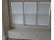 Built-in window seat with white trim under a large window at 209 N Pershing Ave, Indianapolis, IN 46222