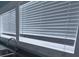 Kitchen sink and faucet with gray countertops and window blinds at 209 N Pershing Ave, Indianapolis, IN 46222