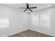 Charming bedroom with ceiling fan, neutral walls, and plush carpeting at 221 Eastern Ave, Indianapolis, IN 46201