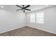 Simple bedroom with neutral walls, carpet, and a ceiling fan at 221 Eastern Ave, Indianapolis, IN 46201