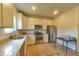 Bright kitchen with white cabinets, granite countertops, and stainless steel appliances at 1184 Lakeshore Drive, Greenwood, IN 46143