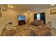 Finished basement with sectional sofa and large TV at 1184 Lakeshore Drive, Greenwood, IN 46143