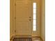 Interior view of a white front door with a blue rug at 1184 Lakeshore Drive, Greenwood, IN 46143
