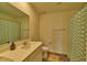 Clean bathroom with single sink and shower/tub combo at 1184 Lakeshore Drive, Greenwood, IN 46143