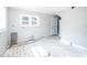 Kitchen features new paint and tile floors ready for renovation at 819 E 49Th St, Indianapolis, IN 46205
