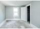 Empty bedroom with gray walls, hardwood floors, and closet at 819 E 49Th St, Indianapolis, IN 46205