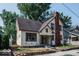 Two-story home with brick chimney and mature trees at 819 E 49Th St, Indianapolis, IN 46205