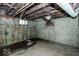Unfinished basement with exposed pipes and brick walls at 819 E 49Th St, Indianapolis, IN 46205