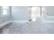 View of the living room, hardwood floors, and a view into the hallway at 819 E 49Th St, Indianapolis, IN 46205