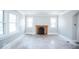 Spacious living room with hardwood floors, crown molding, and a fireplace at 819 E 49Th St, Indianapolis, IN 46205