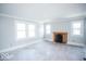 Spacious living room with hardwood floors, crown molding, and a fireplace at 819 E 49Th St, Indianapolis, IN 46205