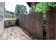 Wooden deck overlooks fenced backyard, offering outdoor space at 819 E 49Th St, Indianapolis, IN 46205