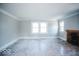 Spacious living room with hardwood floors, crown molding, and a fireplace at 819 E 49Th St, Indianapolis, IN 46205