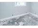 A bedroom with painted walls and new baseboards, awaiting flooring at 819 E 49Th St, Indianapolis, IN 46205