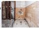 A gutted bathroom ready for renovation, showing existing tile at 819 E 49Th St, Indianapolis, IN 46205
