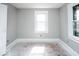 Spacious bedroom with hardwood floors and window at 819 E 49Th St, Indianapolis, IN 46205