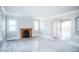 Spacious living room with hardwood floors, crown molding, and a fireplace at 819 E 49Th St, Indianapolis, IN 46205