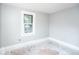 Simple bedroom with new paint and a window at 819 E 49Th St, Indianapolis, IN 46205