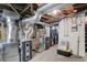Unfinished basement with HVAC and plumbing systems at 621 N State St, Greenfield, IN 46140