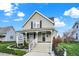 Quaint two-story house with a front porch and well-maintained lawn at 621 N State St, Greenfield, IN 46140