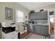 Small kitchen with gray cabinets, stainless steel appliances, and tin backsplash at 621 N State St, Greenfield, IN 46140