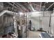 Unfinished basement with boiler and plumbing at 621 N State St, Greenfield, IN 46140