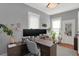 Spacious home office with large desk, dual monitors, and abundant natural light at 621 N State St, Greenfield, IN 46140