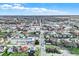 Aerial view of a town's main street, showing businesses and houses at 621 N State St, Greenfield, IN 46140
