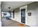 Inviting porch with blue chairs and a welcome mat at 621 N State St, Greenfield, IN 46140