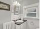 Clean bathroom with white tile and dark vanity at 621 N State St, Greenfield, IN 46140