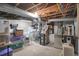 Unfinished basement with HVAC systems and storage at 621 N State St, Greenfield, IN 46140